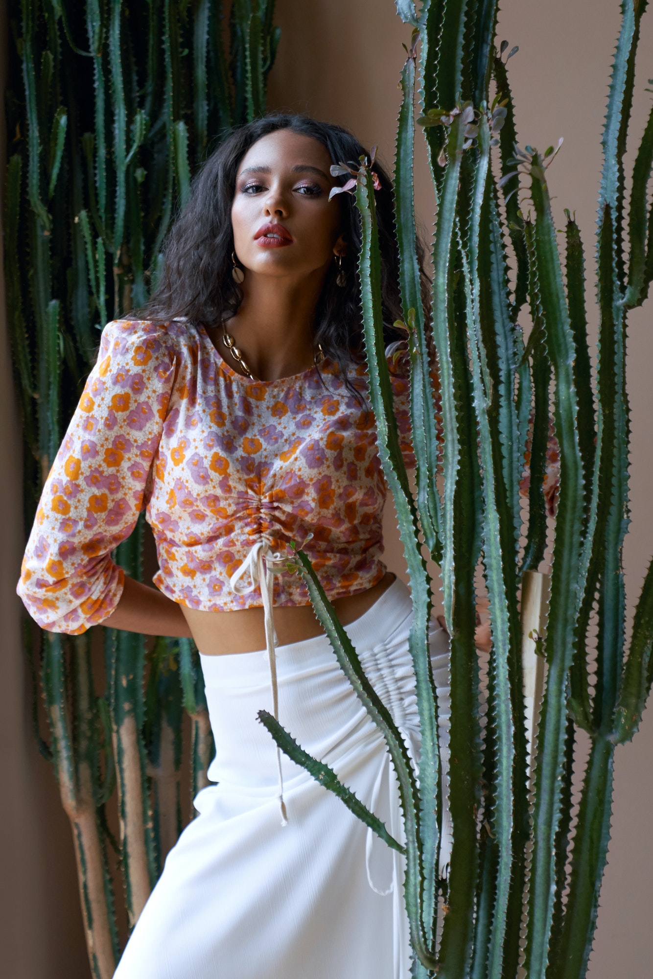 Gorgeous Fashionable Mulatto Female Model Among Cactuses.jpg